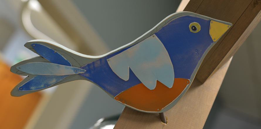 Photo of a blue bird painted on the wall at Bearden Pediatric Dentistry.